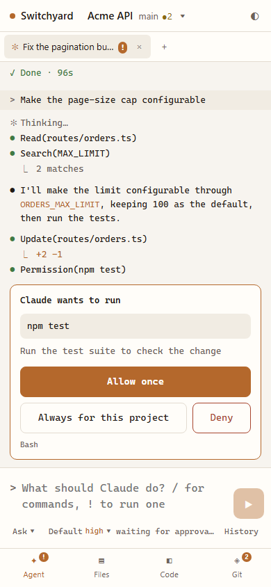 The same session on a phone, with Claude asking to run npm test.
